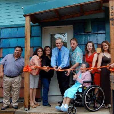 Team members of Austin Community Design & Development Center (ACDDC) and community during ribbon cutting ceremony