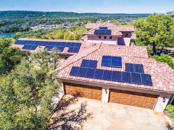 Large home with solar panels on roof