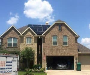 Brick house with solar panels installed on roof